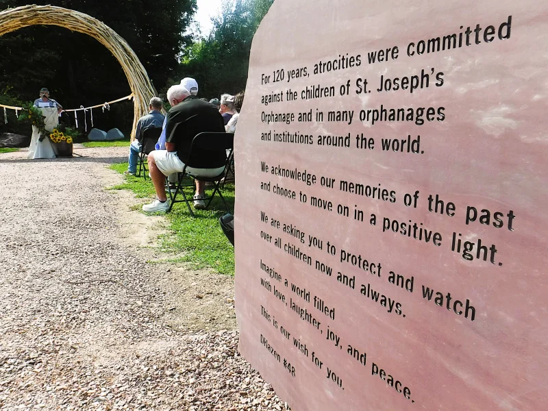 A sculptural arbor and stones etched with the words of survivors are part of a new “memorial healing space” at Burlington’s shuttered St. Joseph’s Orphanage. (Kevin O’Connor/VTDigger)