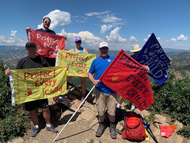 One of hundreds of photos from the 2019 campaign to climb to the top of a hill nearby and post a banner